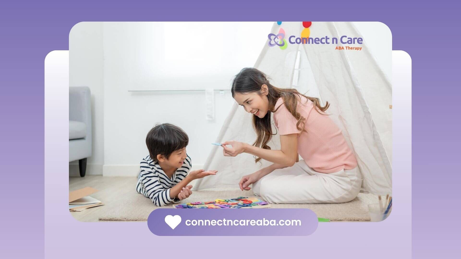 A BCBA is sitting on the floor playing with a child in ABA therapy.
