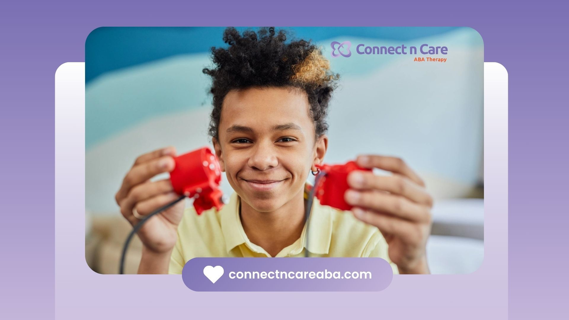 Autistic boy holding up two red plastic components with wires during school-based ABA therapy in NC.