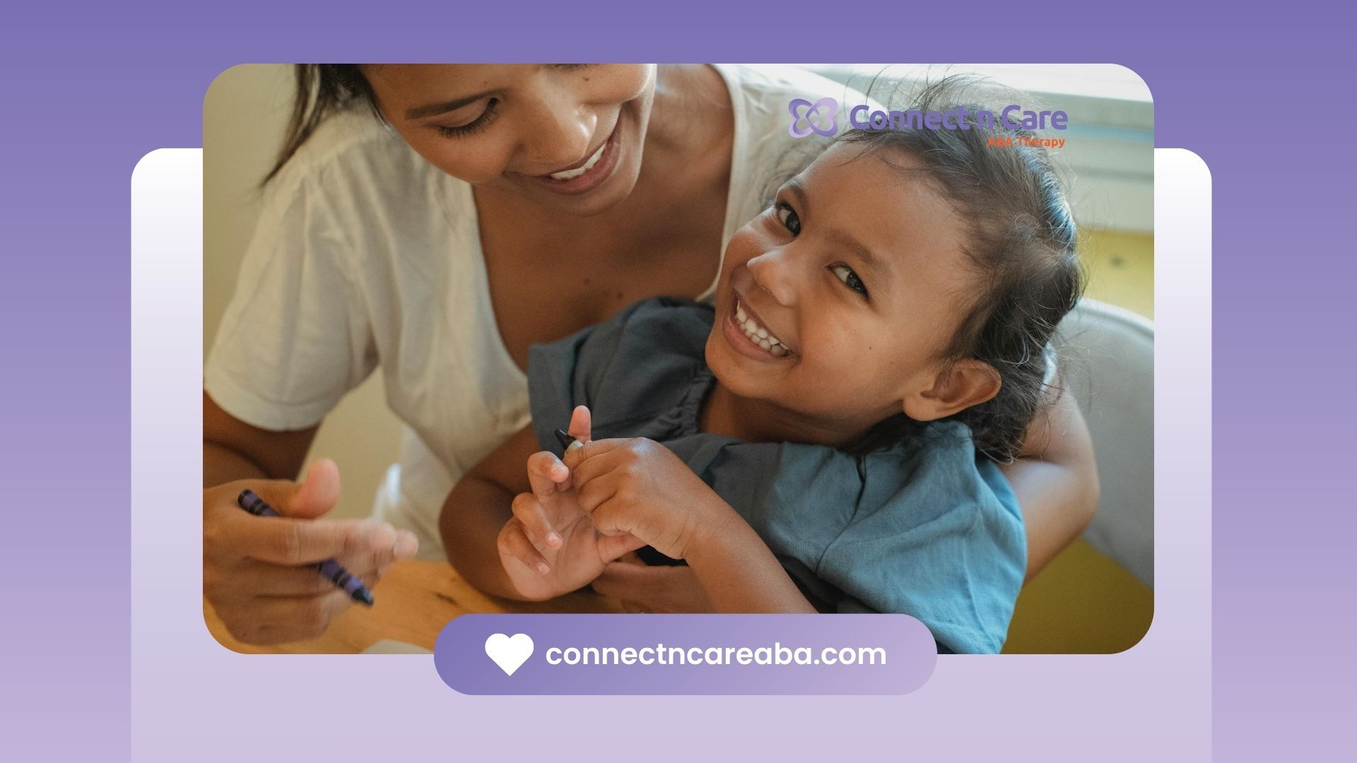 Smiling autistic child holding crayon while sitting with a BCBA during ABA therapy in North Carolina