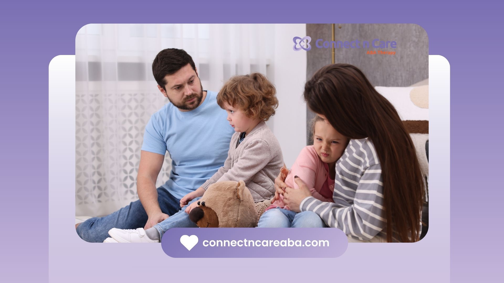 Father comforts children. Mother hugs daughter. All are sitting on floor.