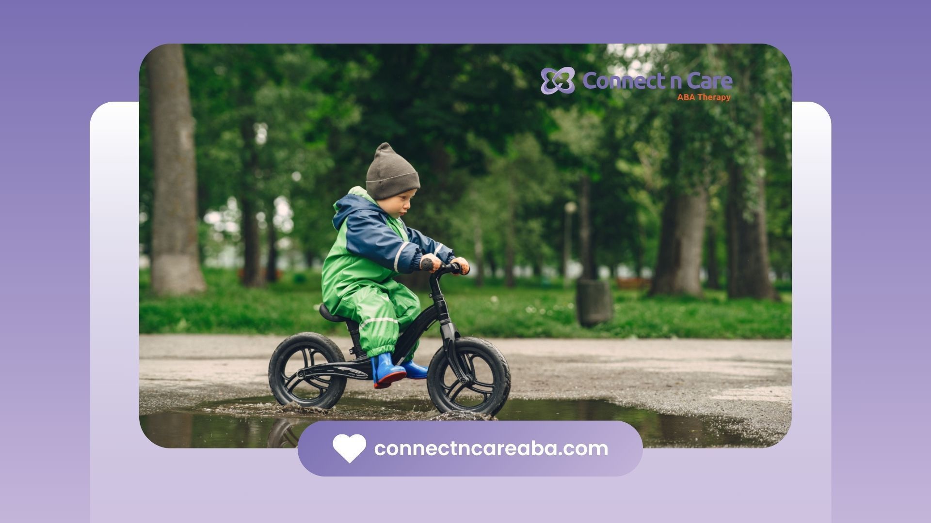 An autistic boy is riding a balance bike in a park.