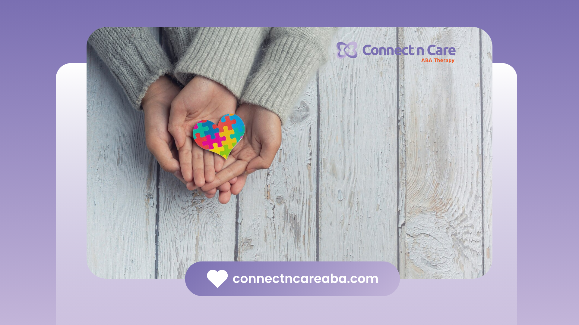 Parent and child holding a colorful, heart-shaped puzzle