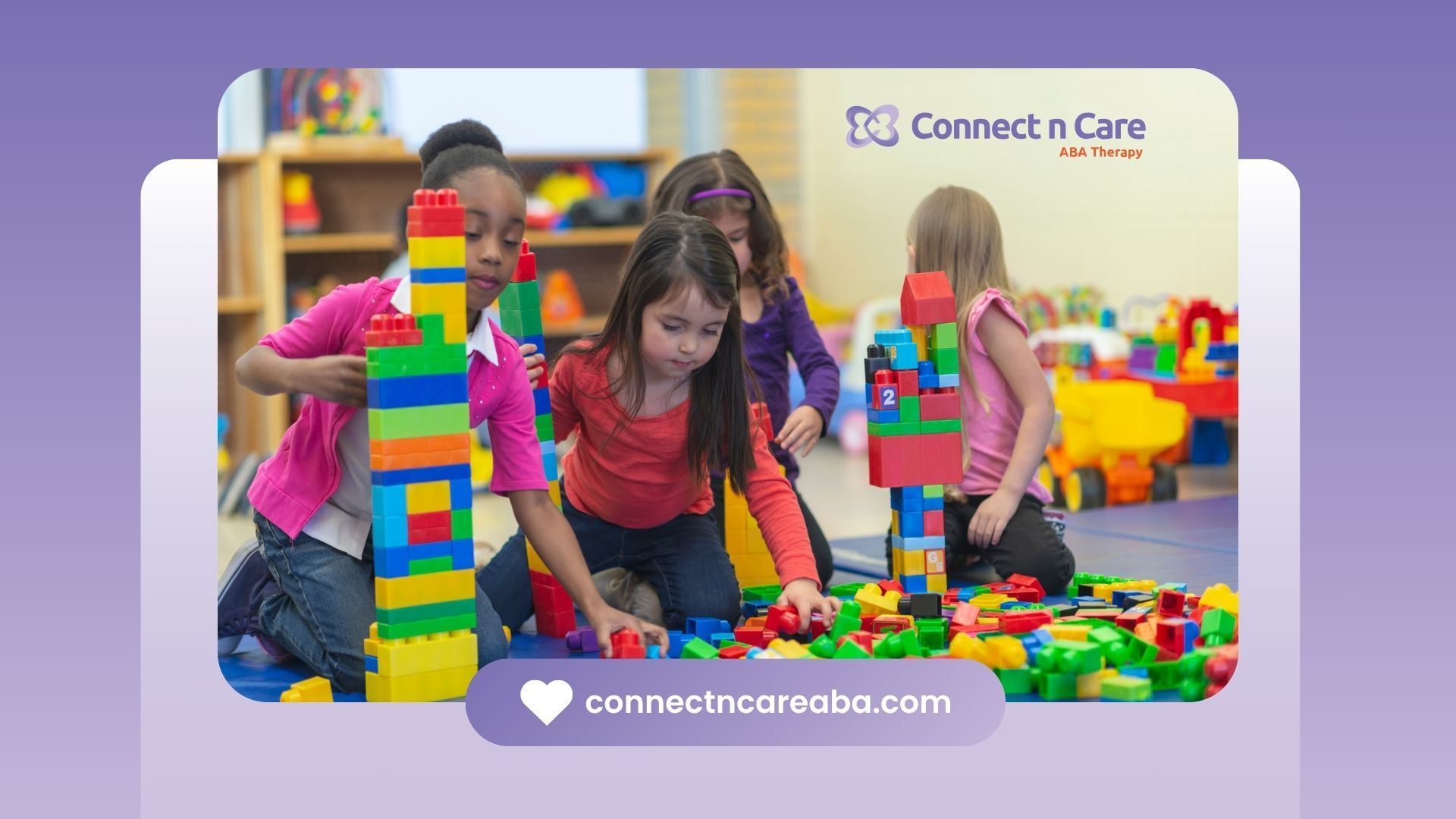 A group of children are playing with lego blocks in a classroom.