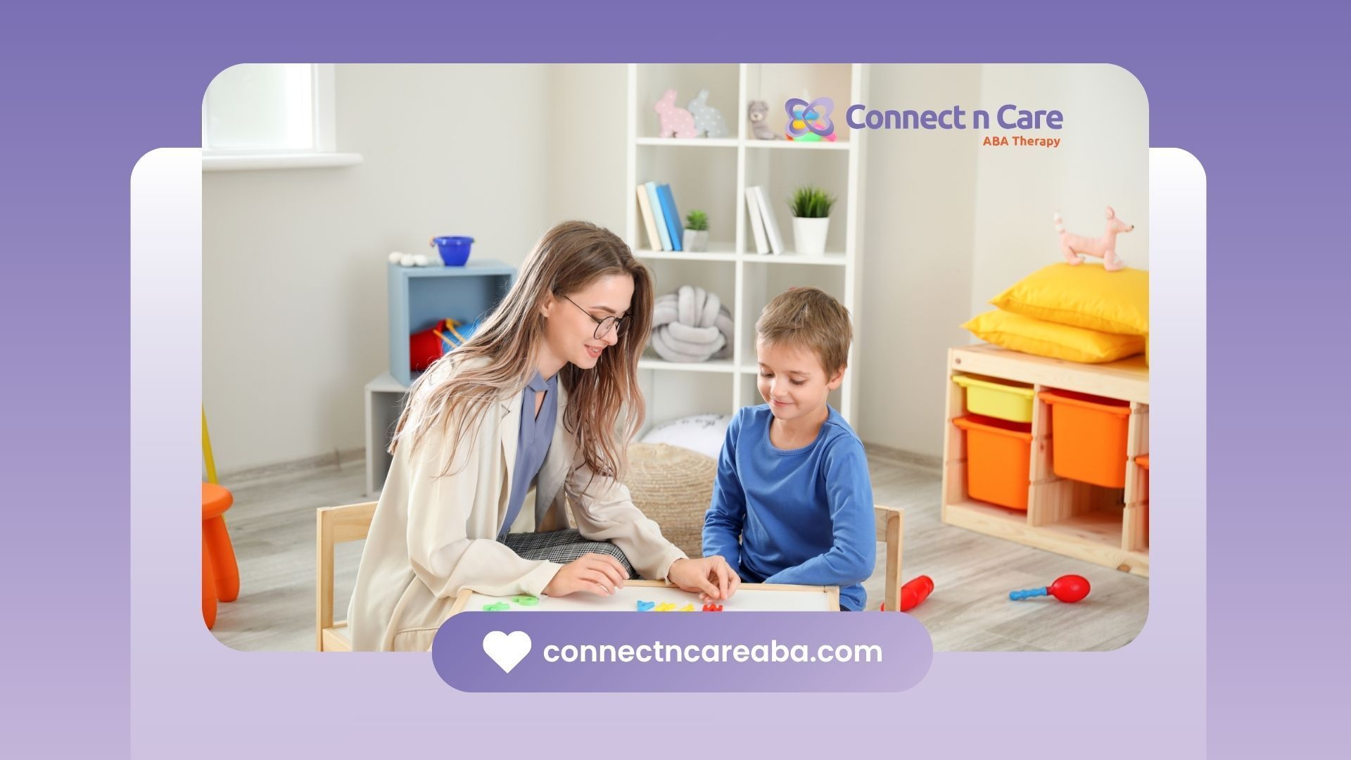 Therapist and child working at a table, in a colorful room.