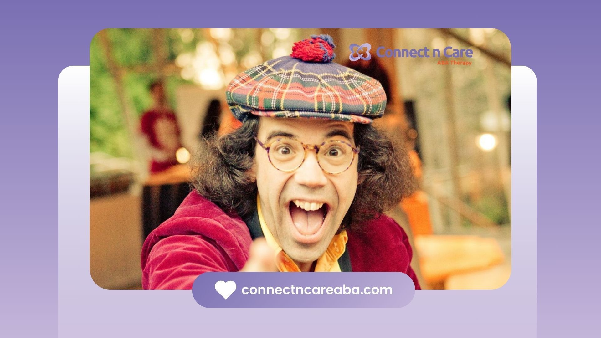 Nardwuar wearing plaid hat and red jacket smiling with mouth open and pointing at camera in NC.