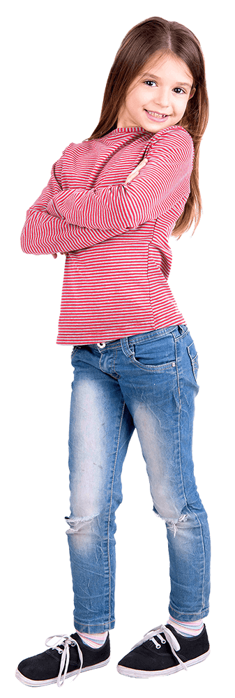 A little girl standing with her arms crossed and smiling 