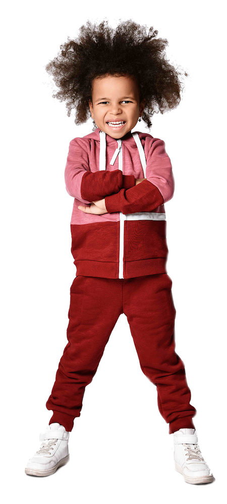 A boy and a girl sitting at a table playing with wooden blocks