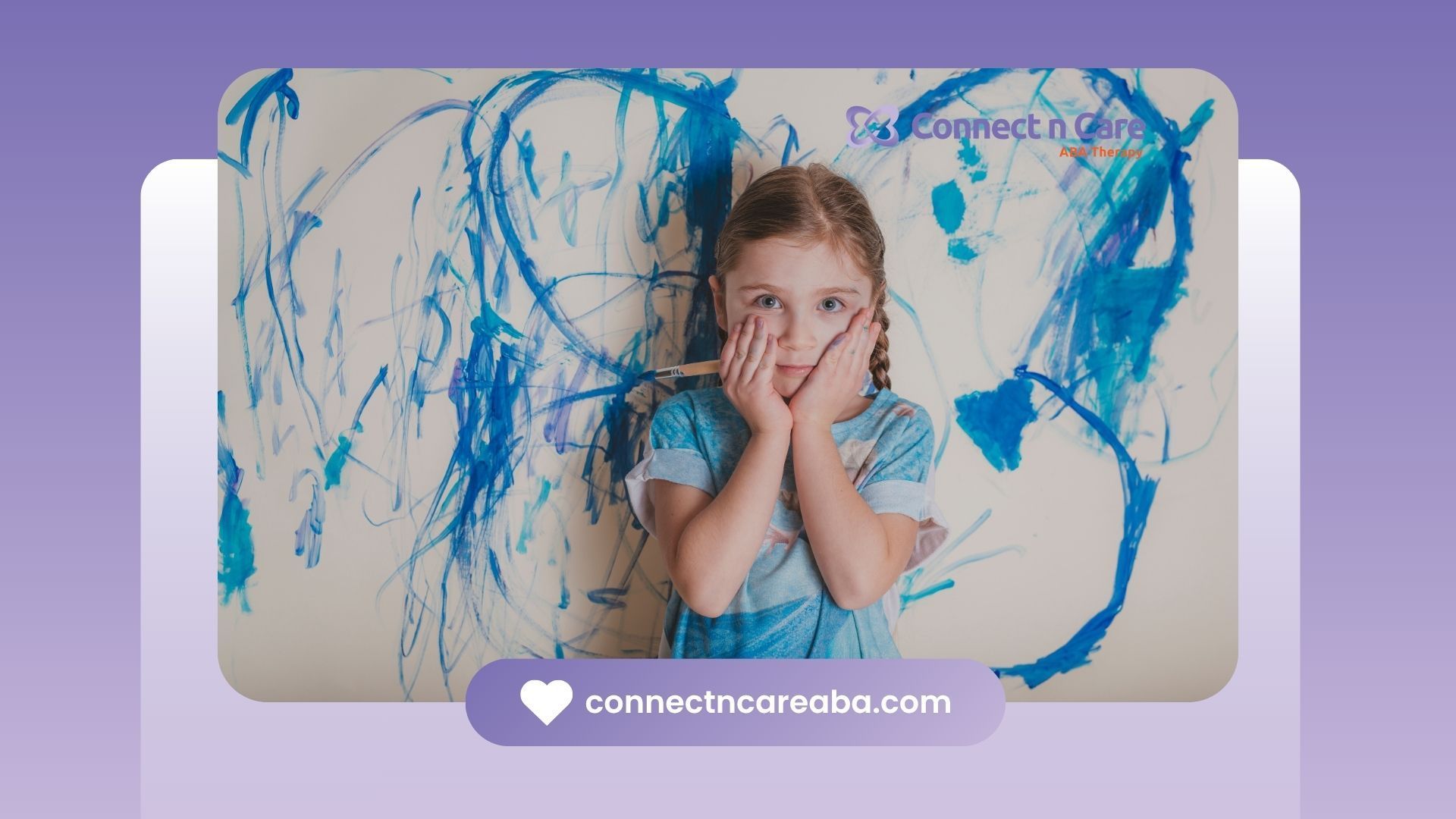 Girl with paint-covered hands and face stands in front of a blue-splattered canvas.