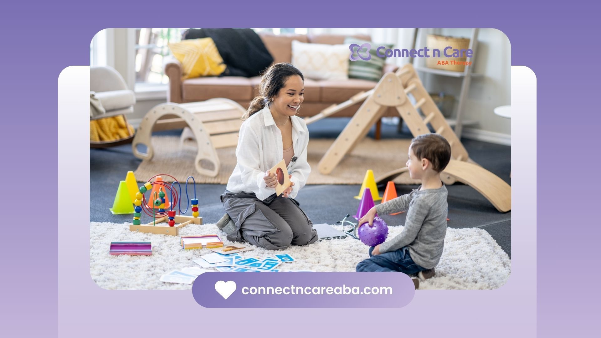 A woman is kneeling on the floor playing with a child.