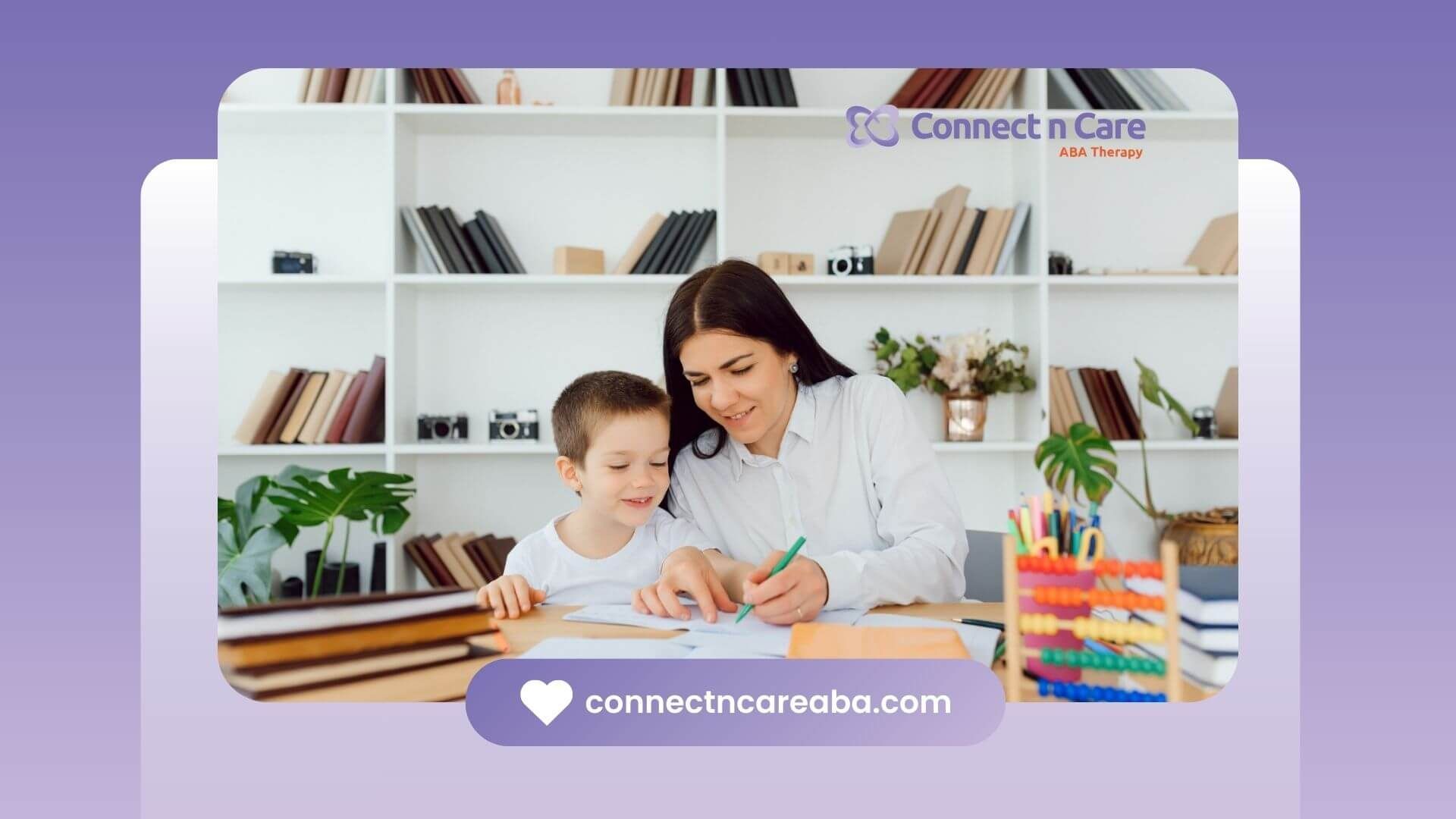 BCBA helping autistic boy with schoolwork at a desk surrounded by books.