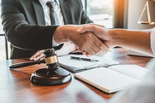 Attorney and Client Handshake — Oak Harbor, OH — McKean & McKean