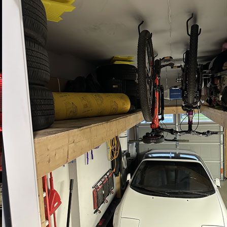 Custom overhead garage storage with bike hanging rack