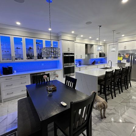 Newly renovated modern kitchen with blue LED lighting under the counter