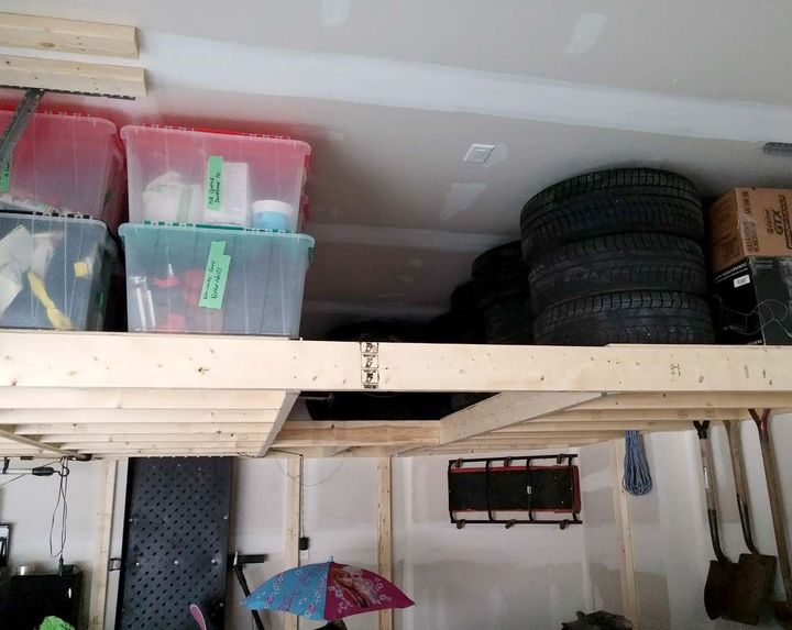 Overhead garage shelving with tires and bin storage