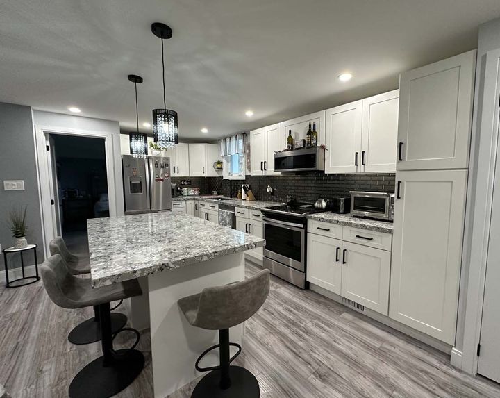 New modern legal basement kitchen with island seating and modern cupboards