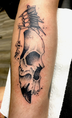 Skull Tattoo in black ink.