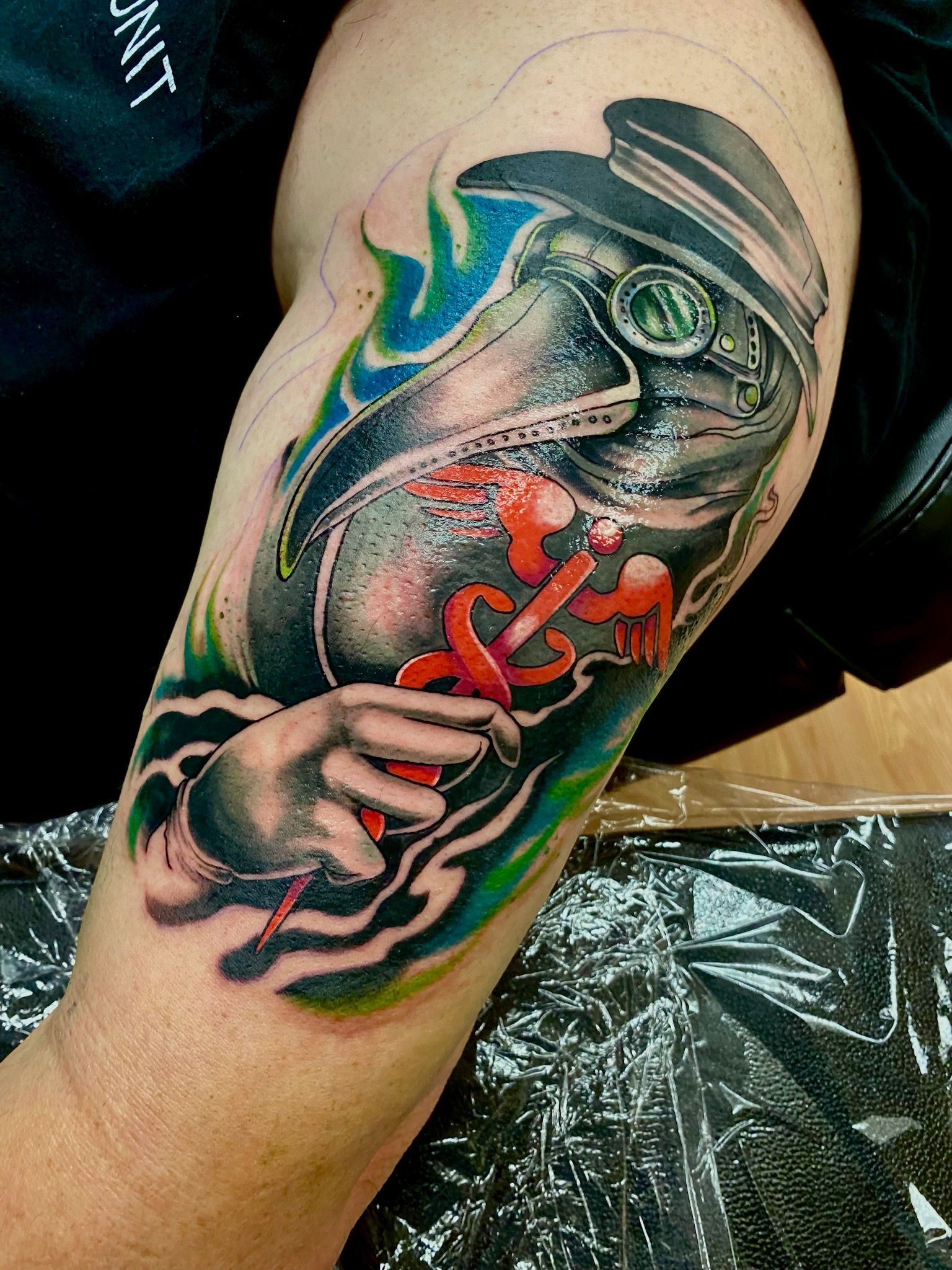 A person has a tattoo of a frog on their arm.