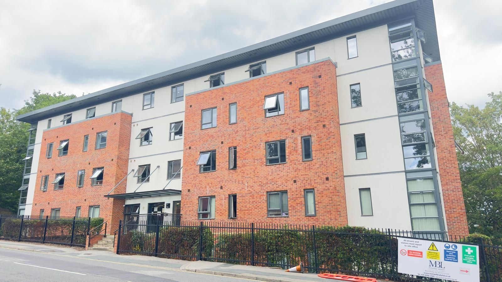 A large brick building with a lot of windows after being cleaned by commercial cleaning company, Spark Cleaning Services.