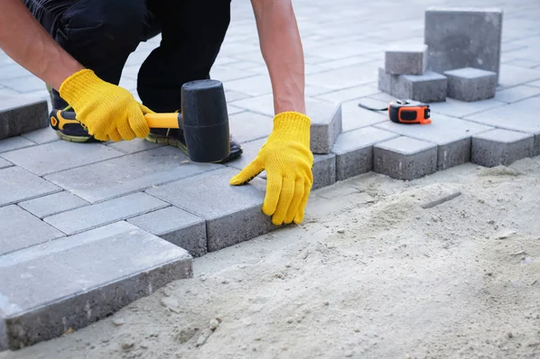 Pavement Laying by construction worker