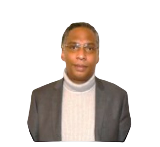 Un homme portant des lunettes, un blazer gris et un col roulé, pose devant un fond blanc.