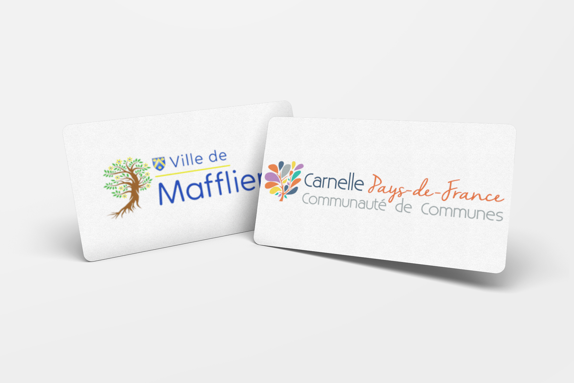Two white cards with logos: Ville de Maffliers and Carnelle Pays-de-France Communauté de Communes.