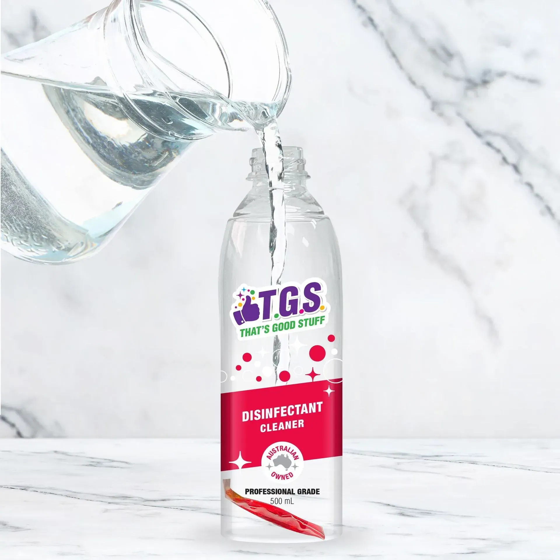A bottle of tgs disinfectant cleaner is being poured into a glass.