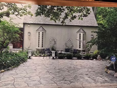 A before and after picture of a brick walkway.