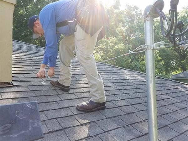 Electrician Fixing the Wire — Licensed Electricians in Merriam, KS