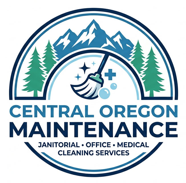 Logo for Central Oregon Maintenance featuring mountains, pine trees, and a broom icon inside a circular navy border.