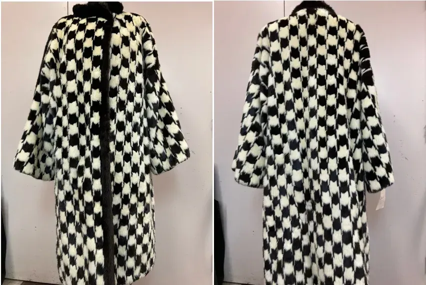 Black and white checkered pattern coat with large bell sleeves; fur collar and trim.