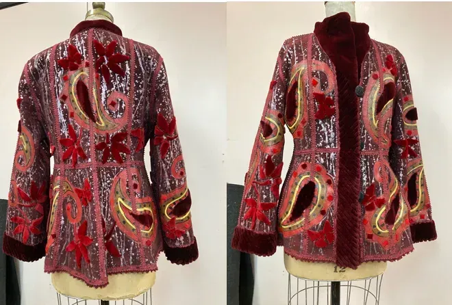 Red and pink sequined jacket with paisley and floral embellishments, on a mannequin.