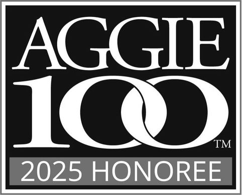 The aggie 100 logo is black and white and looks like a wedding ring.
