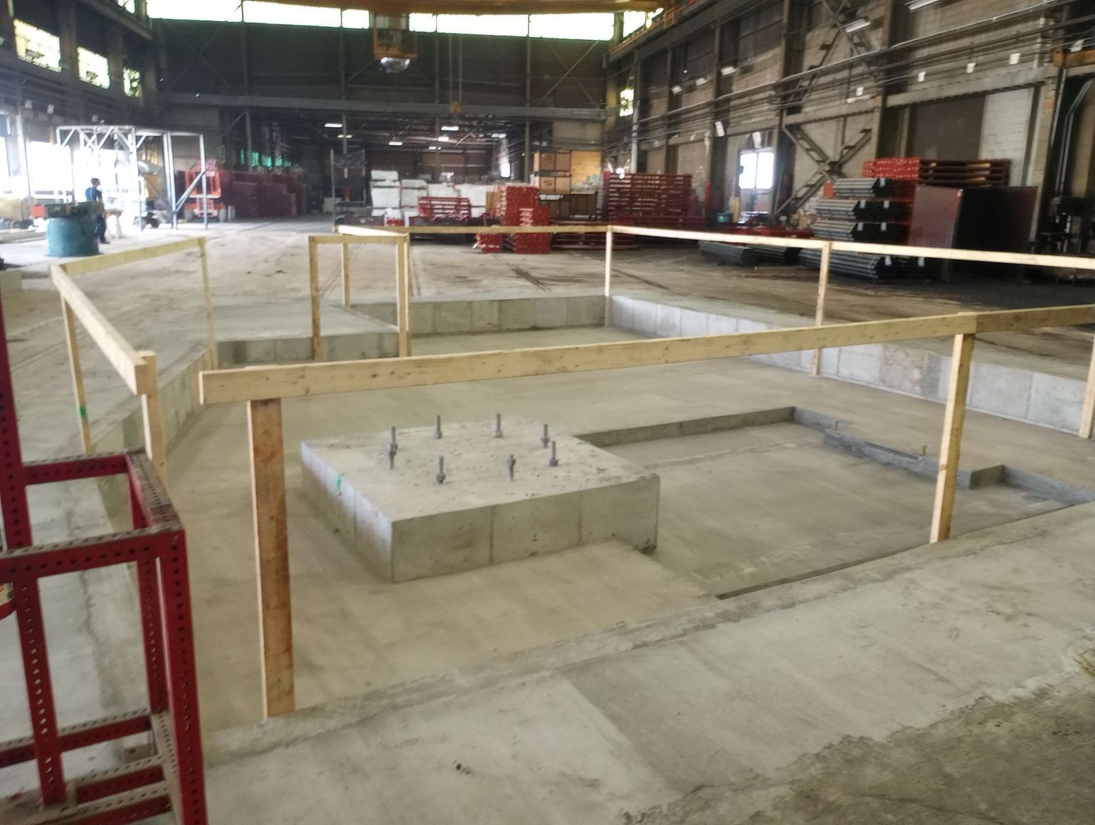 A large building with a wooden fence around it