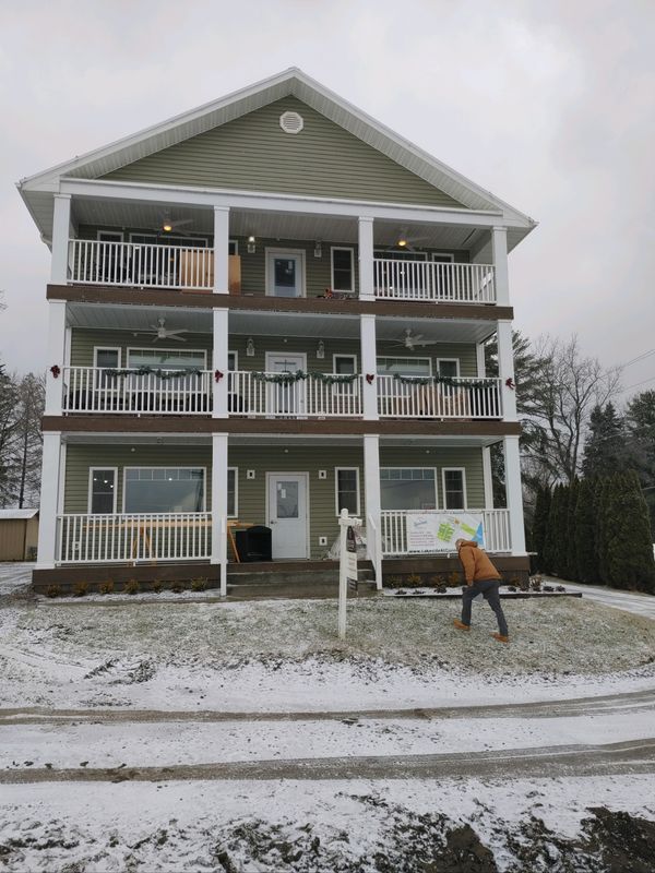 A large house with a lot of windows and balconies