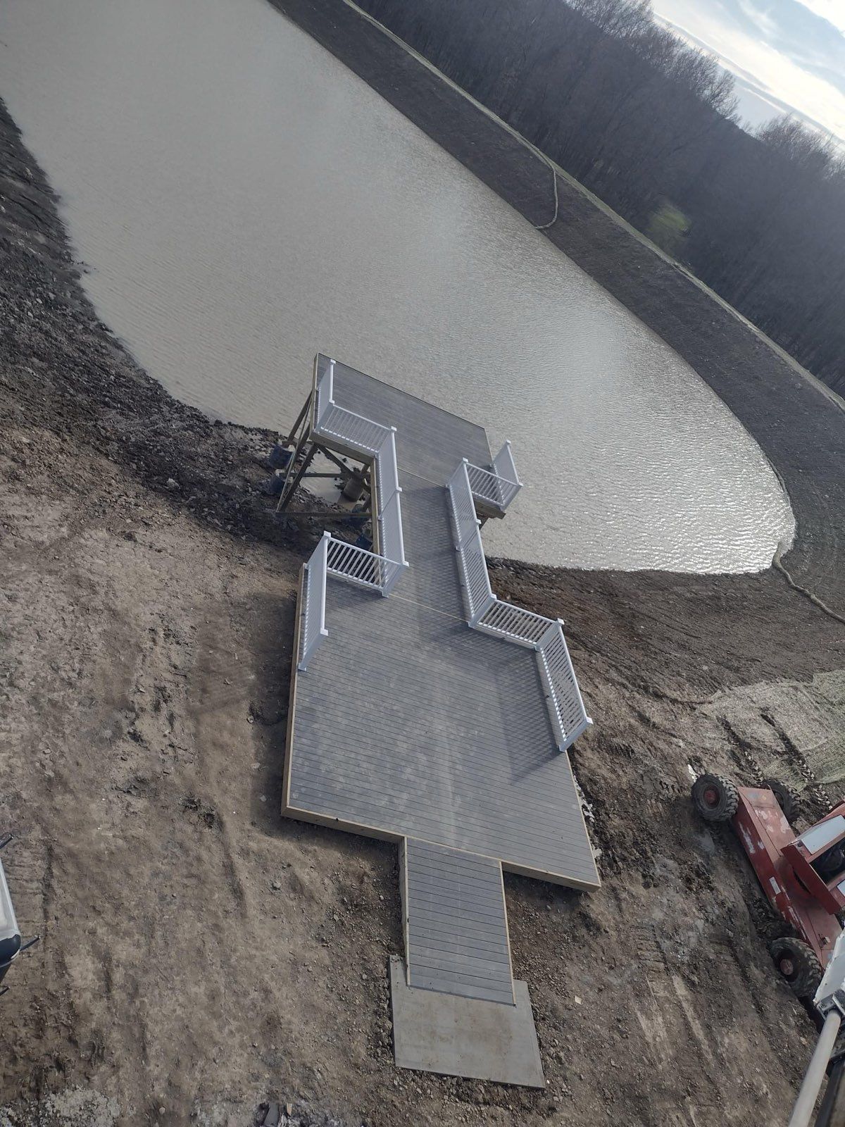 An aerial view of a bridge over a body of water.
