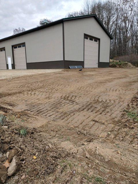 A large building with a lot of dirt in front of it.