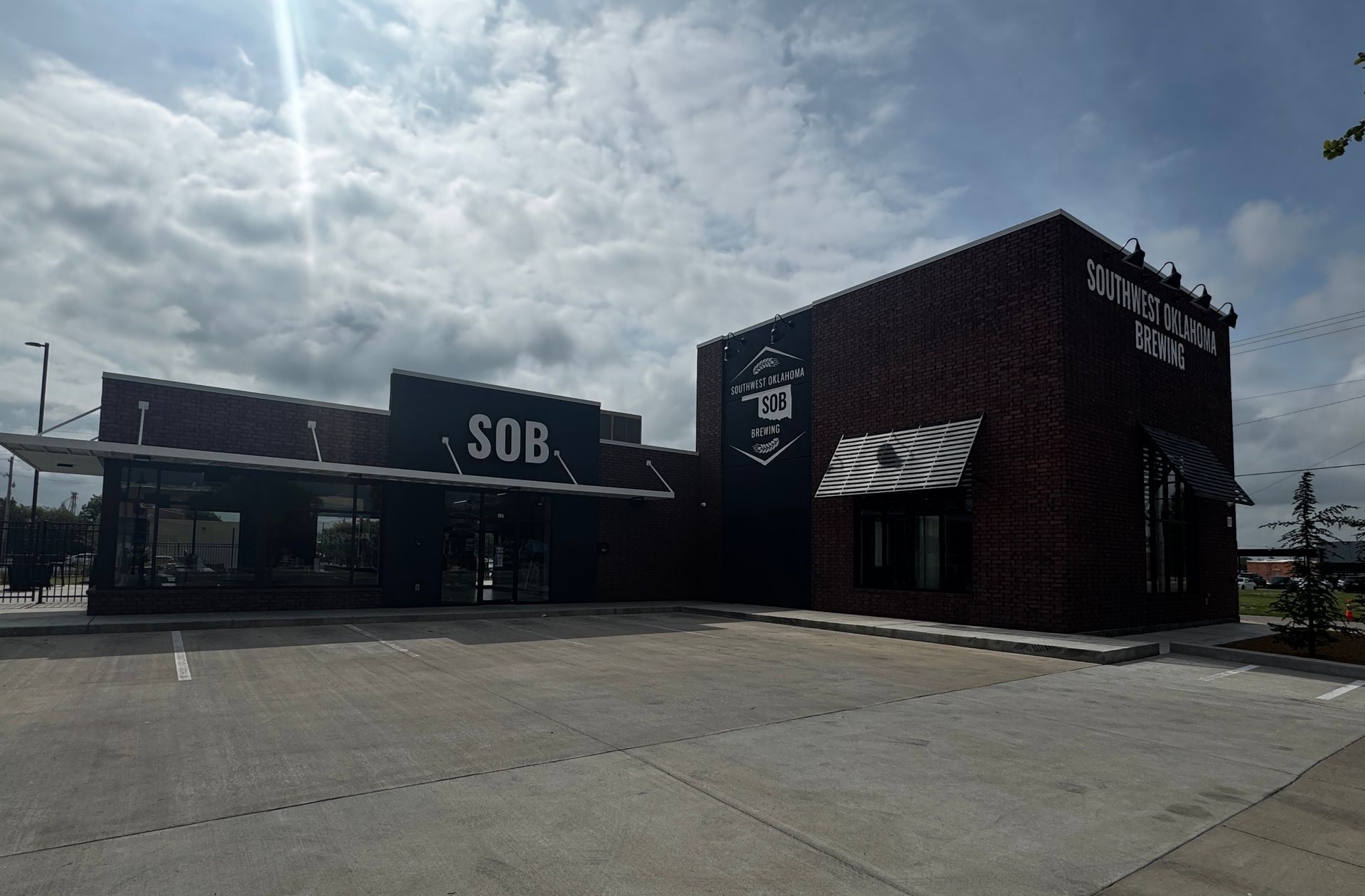 A rendering of a building with a bench in front of it