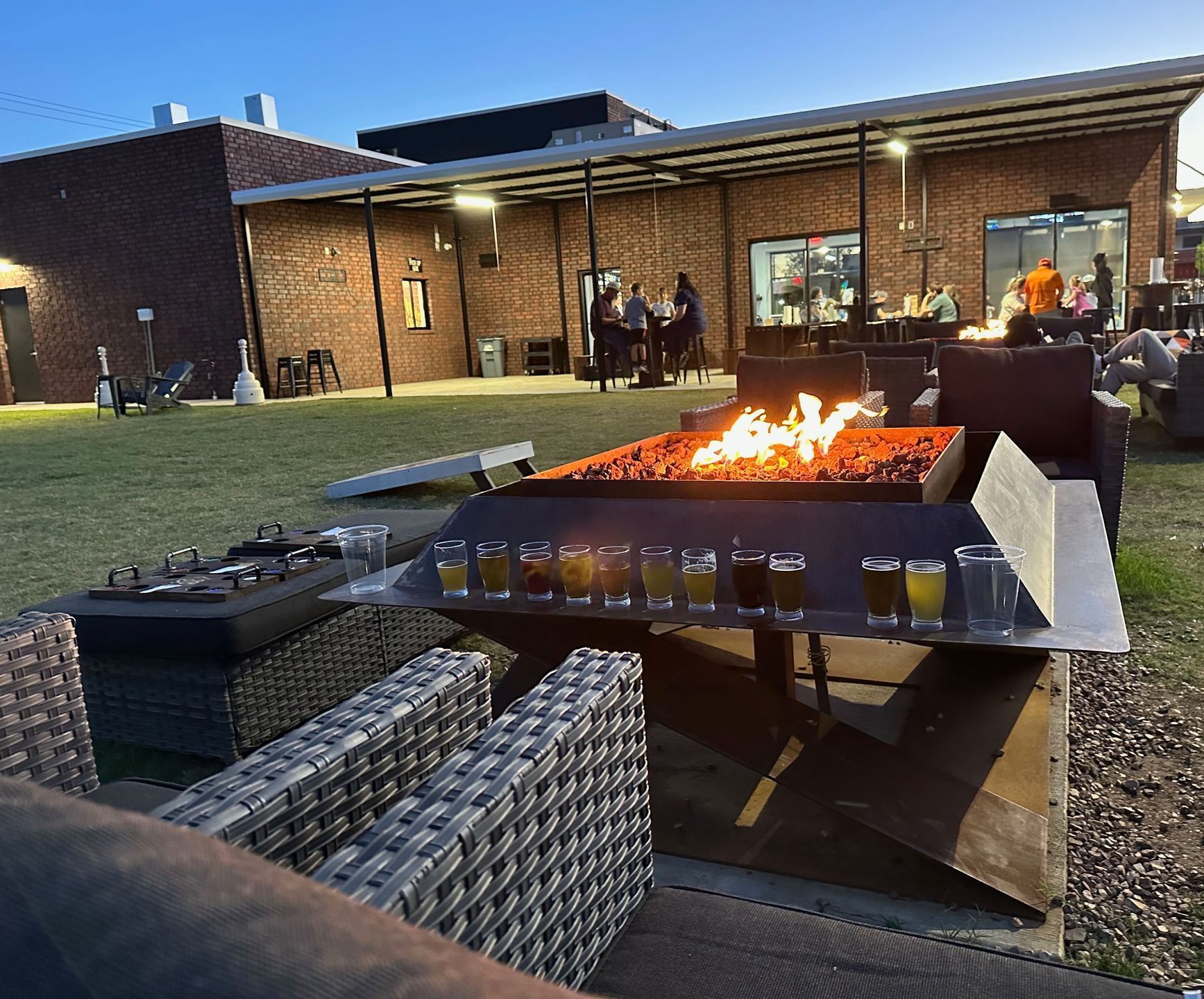 A computer generated image of a pavilion with tables and benches