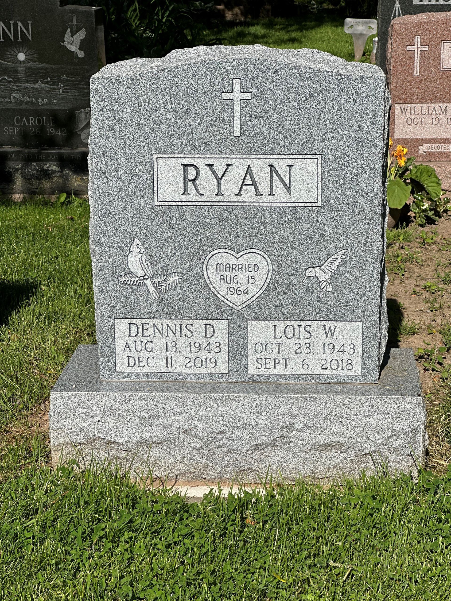 A gravestone in a cemetery with the name ryan on it.