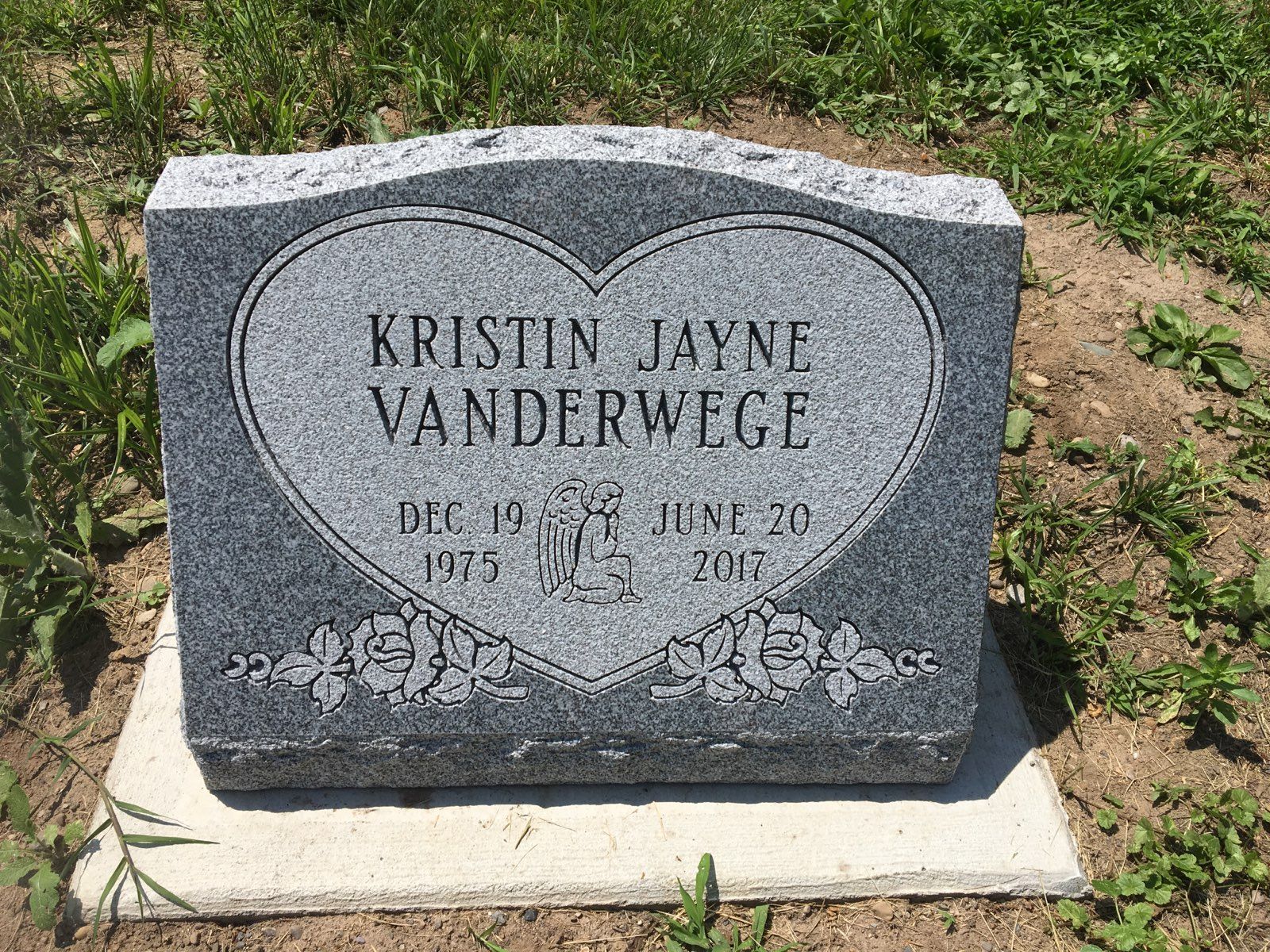 Gray granite headstone with heart design, 