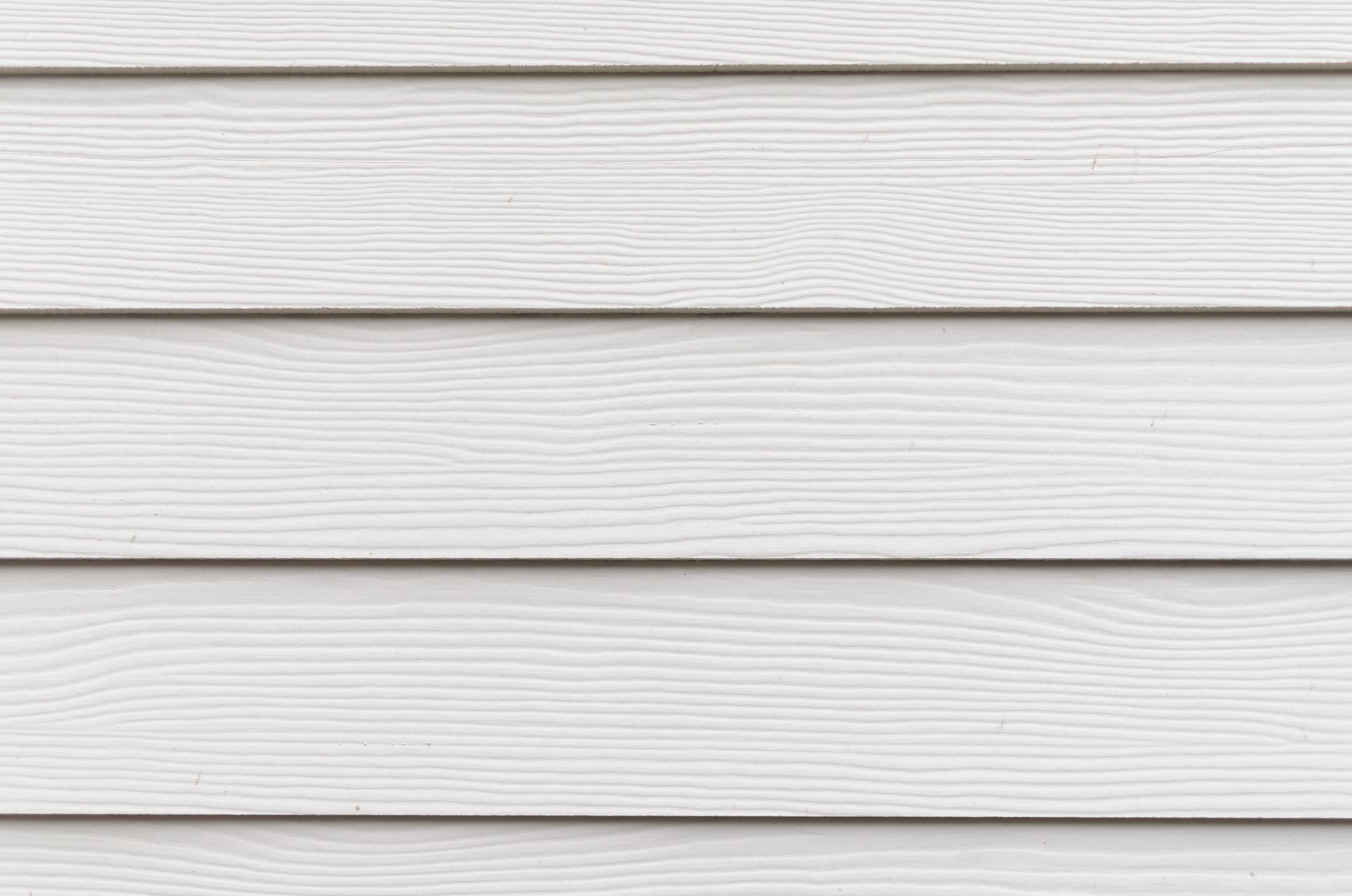 Horizontal light gray wooden siding panels with a visible wood grain texture.