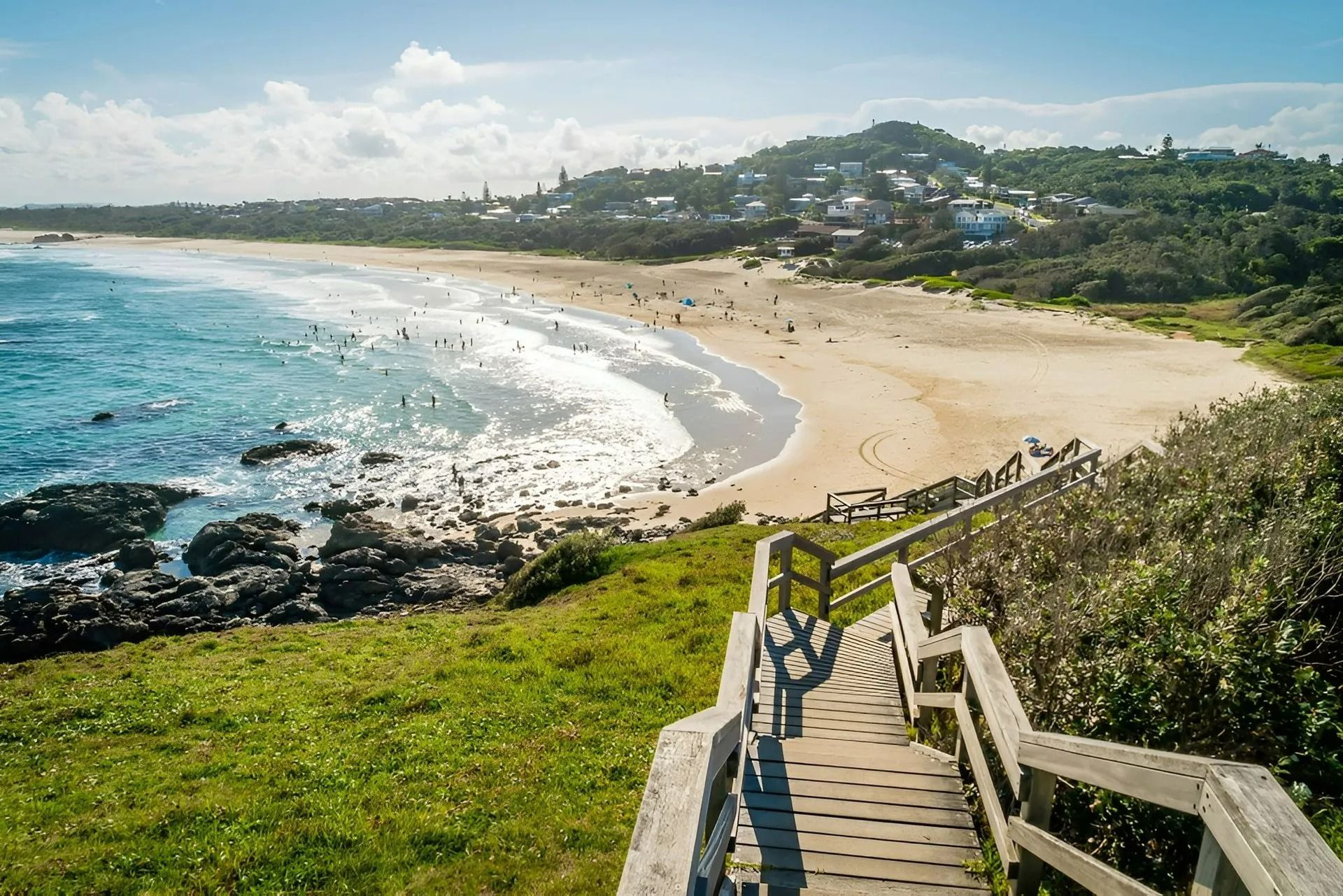 A Wooden Walkway Leading to A Beach with A View of The Ocean — Oz-Craft in Port Macquarie, NSW