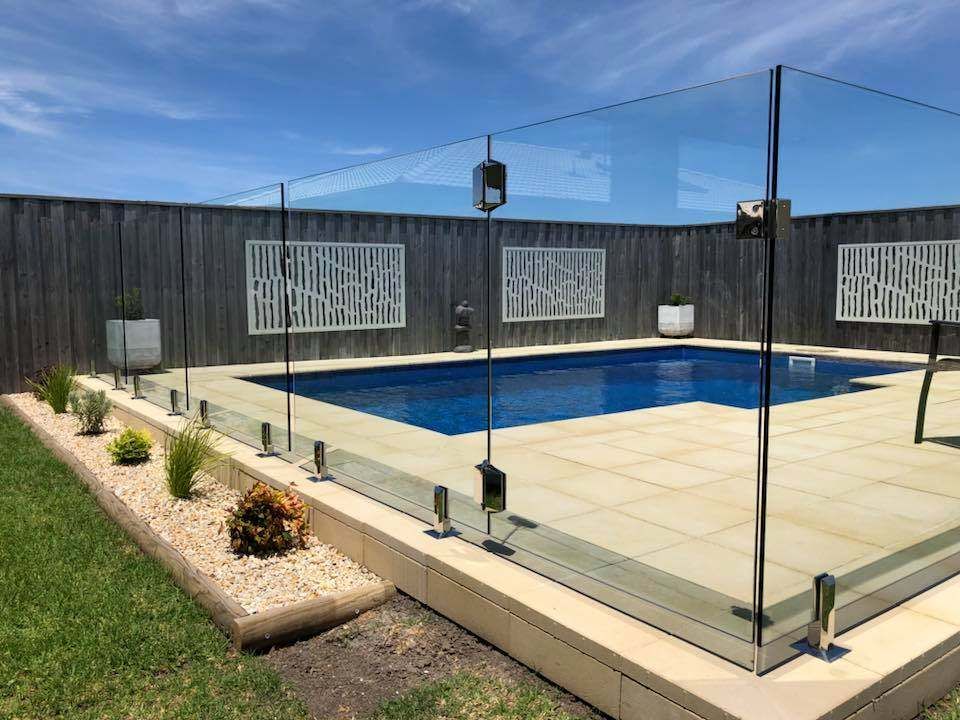 A Large Swimming Pool Surrounded by A Glass Fence — Oz-Craft in Port Macquarie, NSW