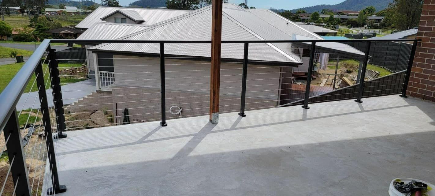 A Balcony with A Railing and A View of A House — Oz-Craft in Forster, NSW