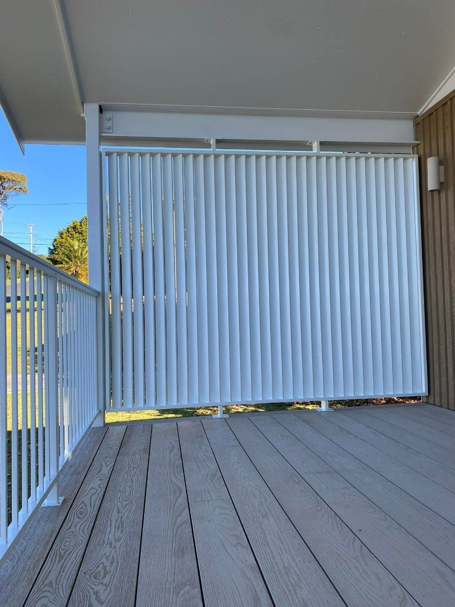 A Balcony with A White Fence and A Wooden Floor — Oz-Craft in Taree, NSW