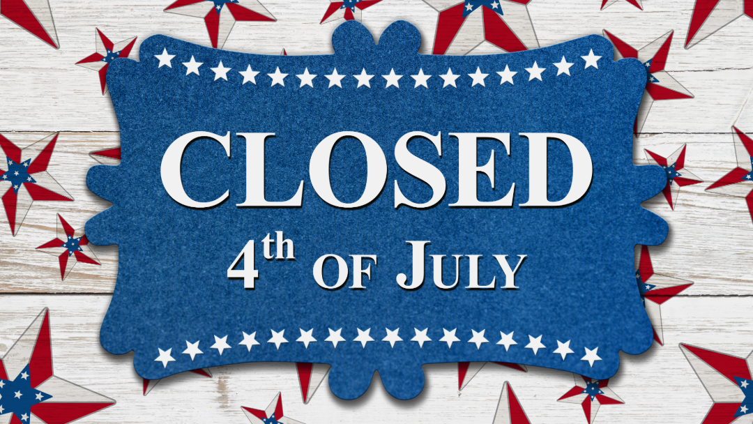 A group of people holding certificates and stuffed animals in front of a sign that says heel