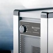 Silver air purifier with black trim, control panel, and vent.