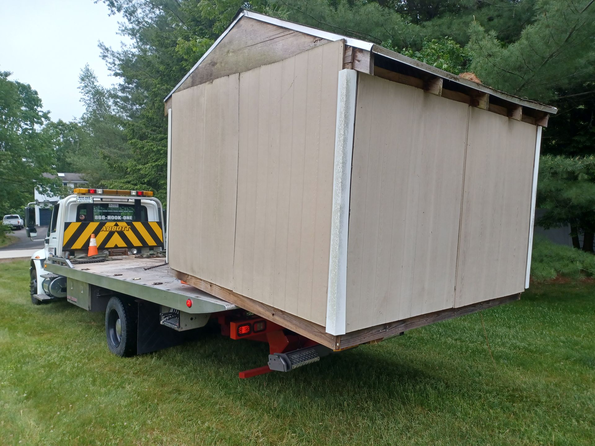 A Truck Carrying a Shed — Hudson, NH — Abbott Towing Service