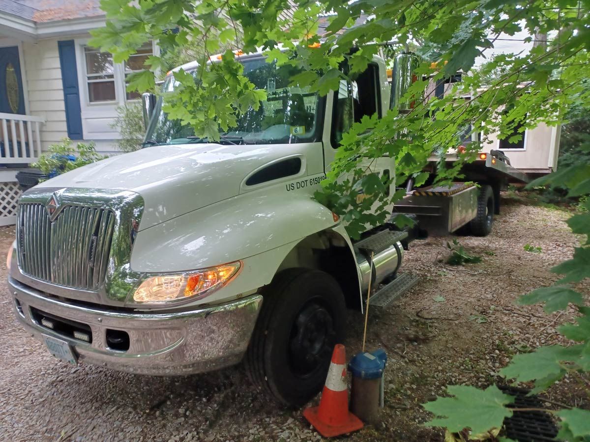 A Truck Parked Under the Tree — Hudson, NH — Abbott Towing Service