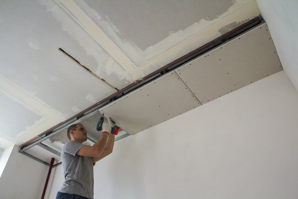 man installing drywall in Orange County